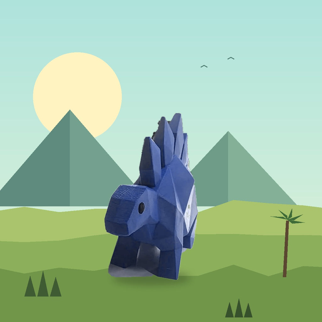 Blue Stegosaurus 3D printed dinosaur doorstop by a door